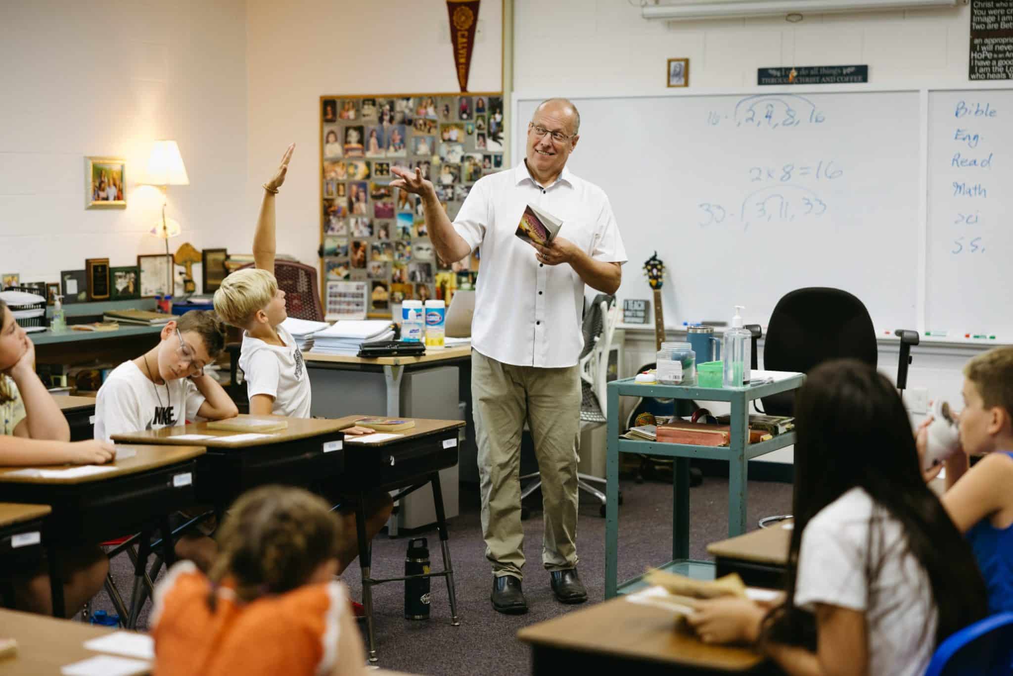 A teacher addressing the class in a lesson