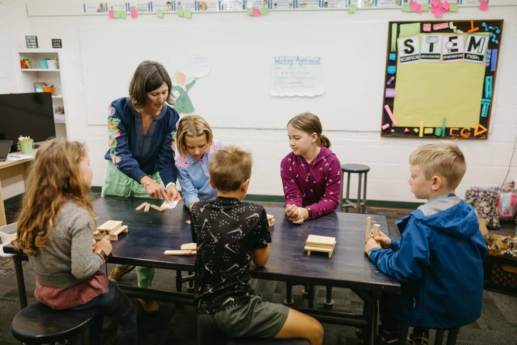 Students in class building mini tables