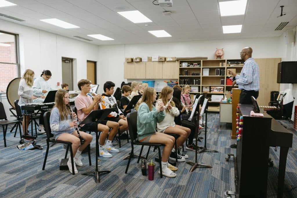 Students playing instruments in band class