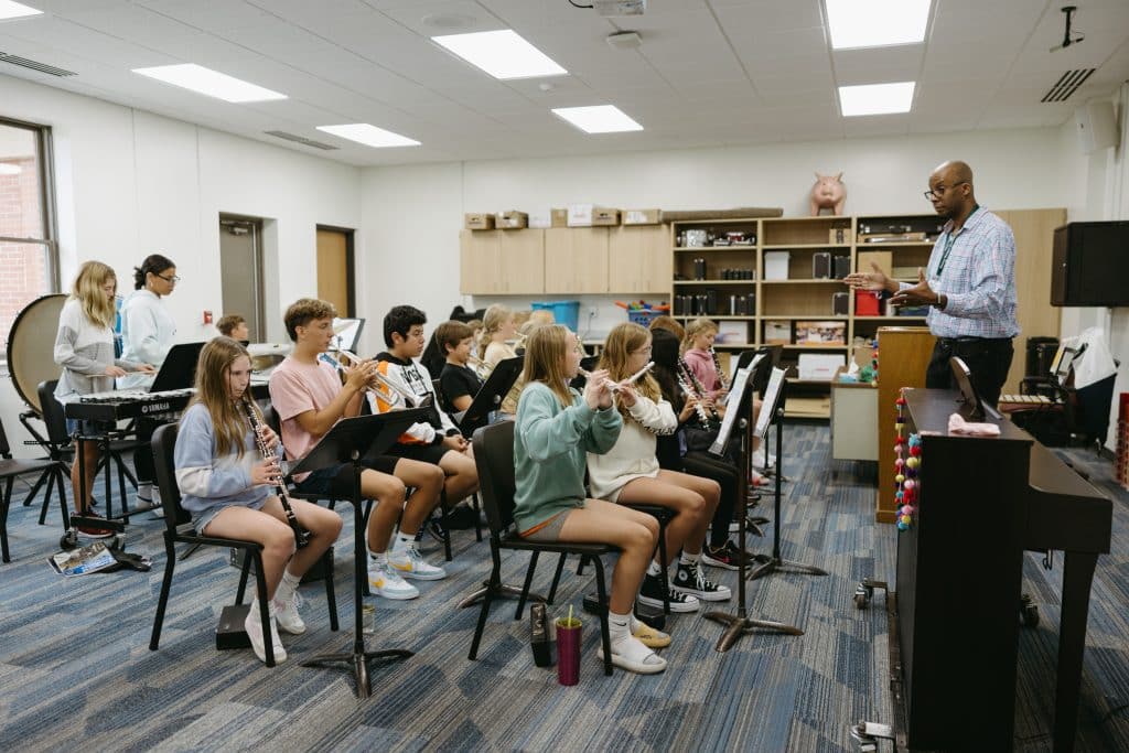 Students playing instruments in band class