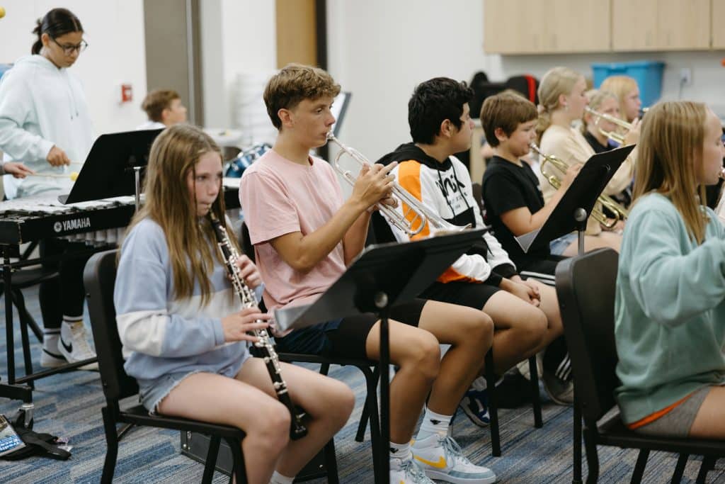 Students playing instruments in band class
