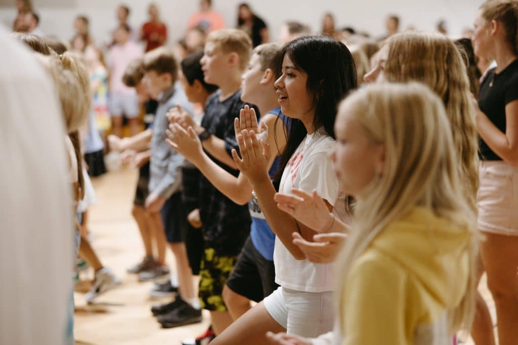 Students clapping and dancing to a beat